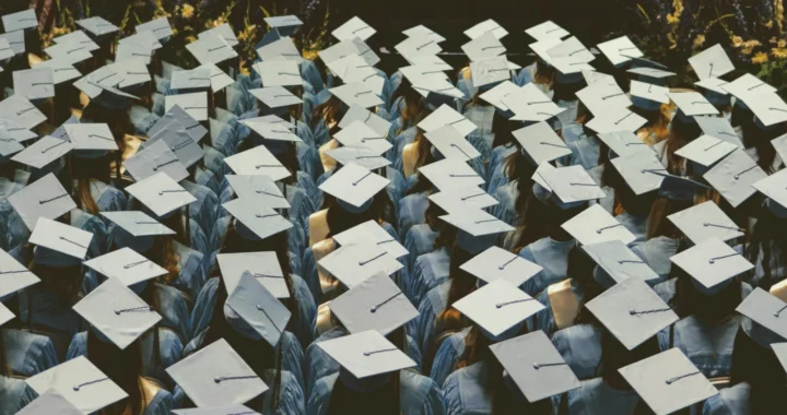 A graduation cap symbolizes the growing number of graduates facing limited job opportunities.
