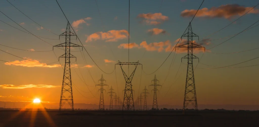 several power grids against a sunset sky