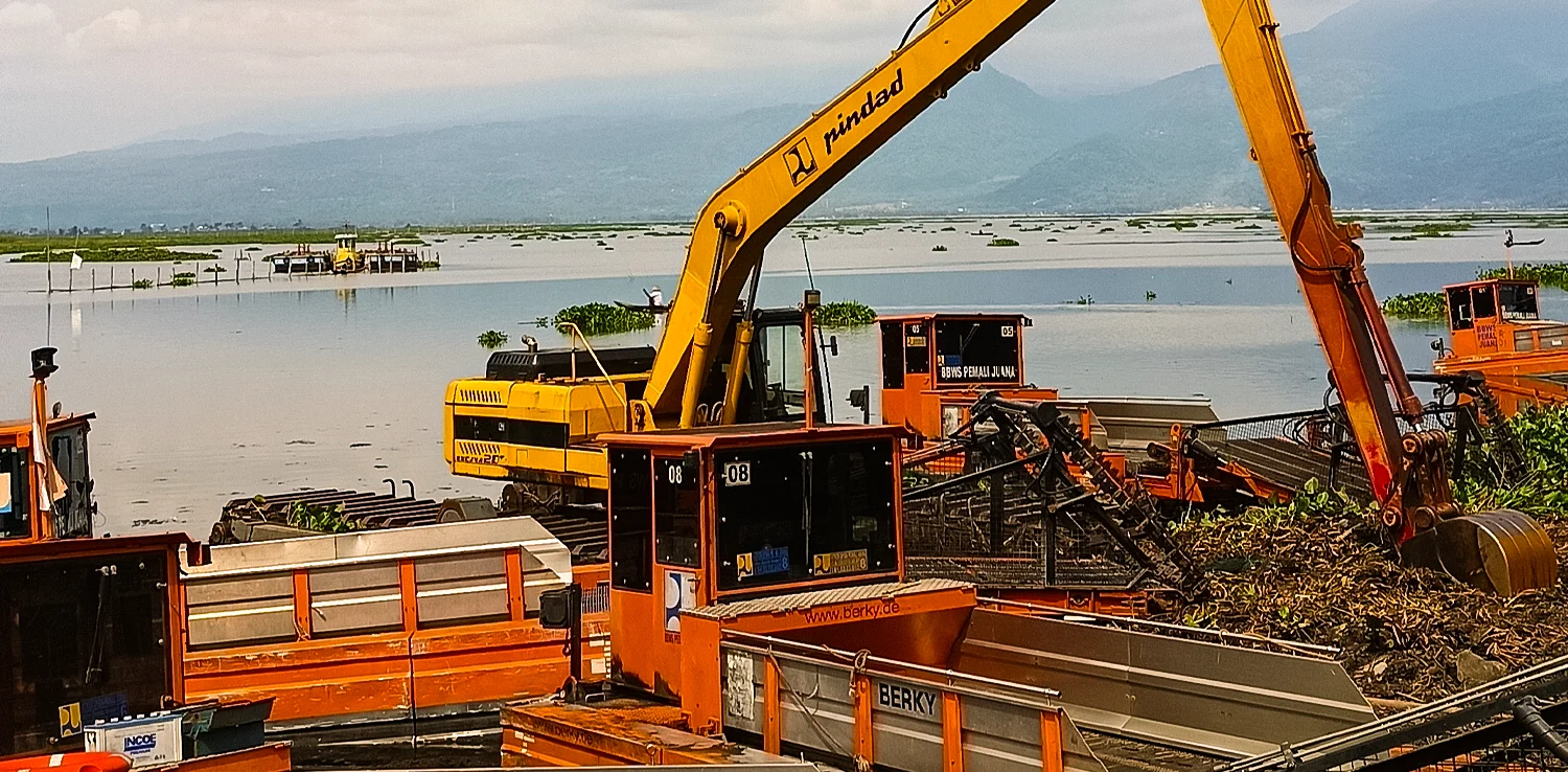 excavator by the lakeside of Rawa pening