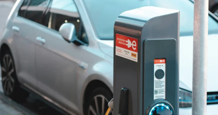 a charging station with an electric car parked next to it.