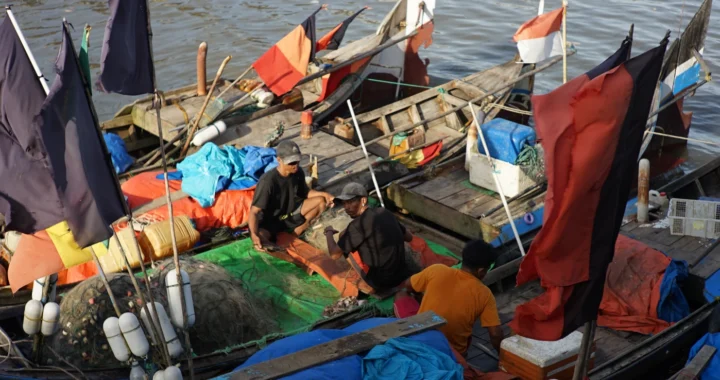 three fishers on a boat