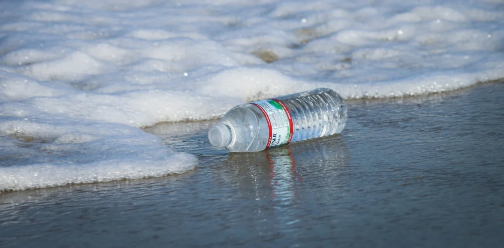 A plastic water bottle washed up on seashore