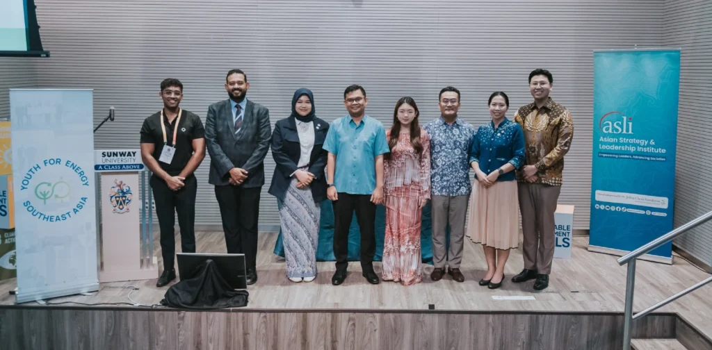 eight people standing on a podium