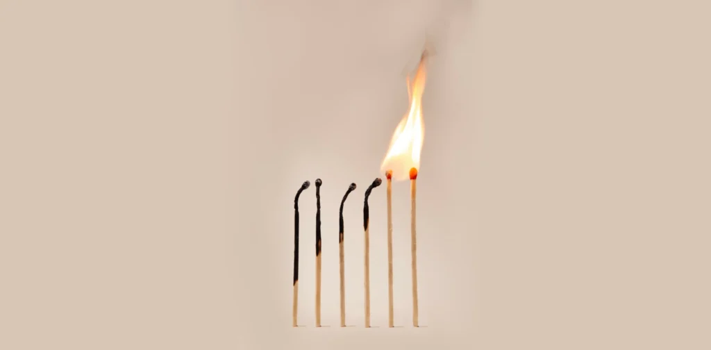 burning matches arranged side by side