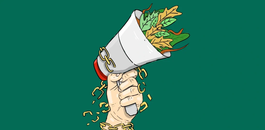 raised hand holding megaphone with breaking chain