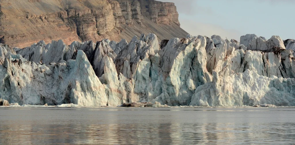 large glaciers with a mountain in the background