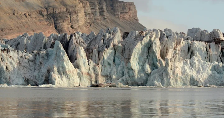 large glaciers with a mountain in the background