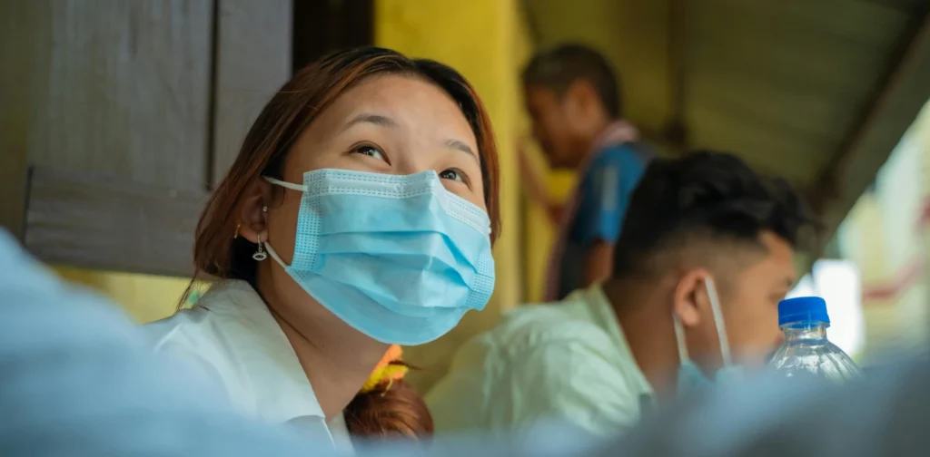 an asian woman with mask on