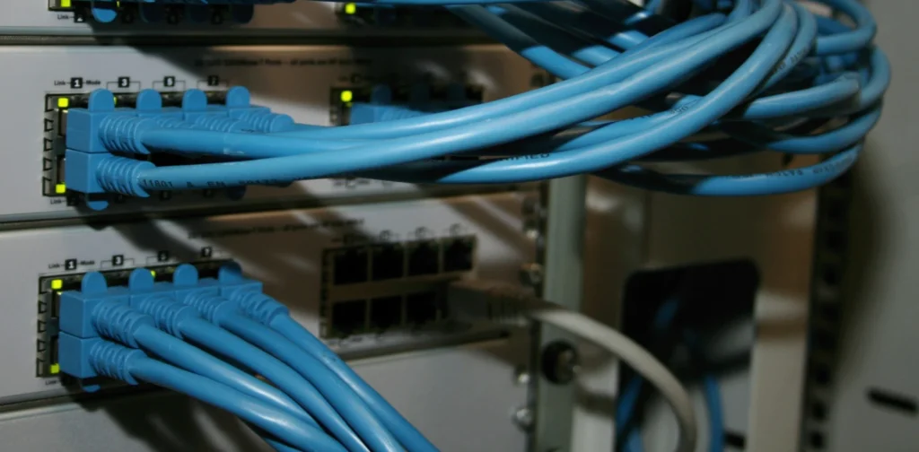 multiple blue cables plugged on a machine