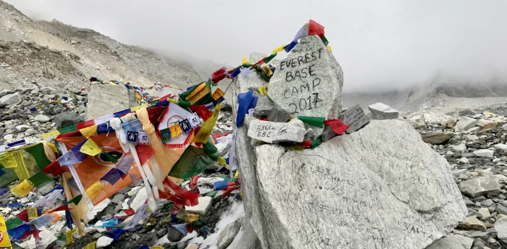 Flags and litters at the base camp of the Mount Everest