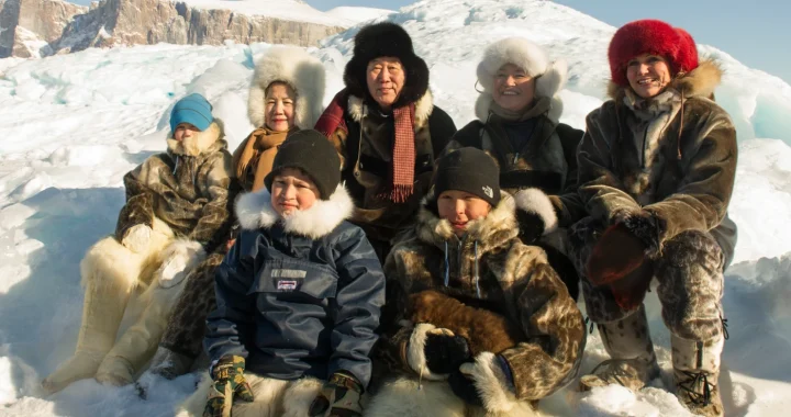 Ban Ki-moon with Inuit people with thick jackets on snow