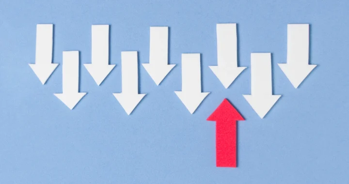 one red up arrow and 9 down arrows