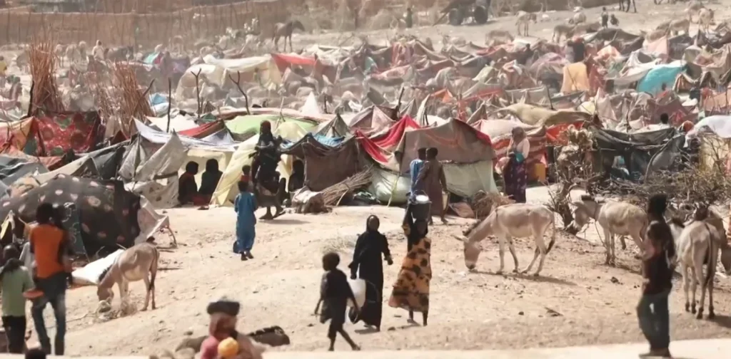 A Sudanese refugee camp in eastern Chad, showing rows of shelters where families fled after crossing the border from Darfur.