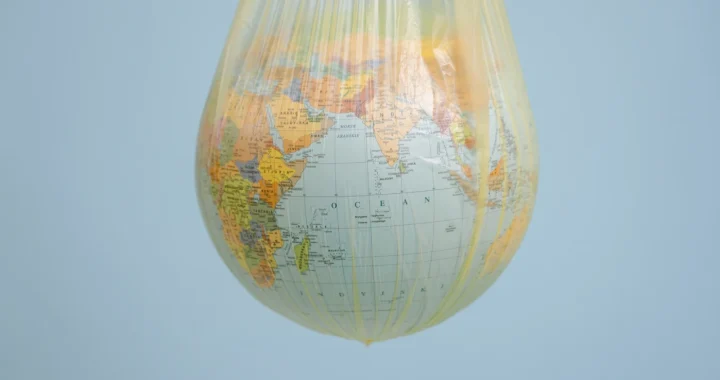 a globe hanging in a yellow plastic bag
