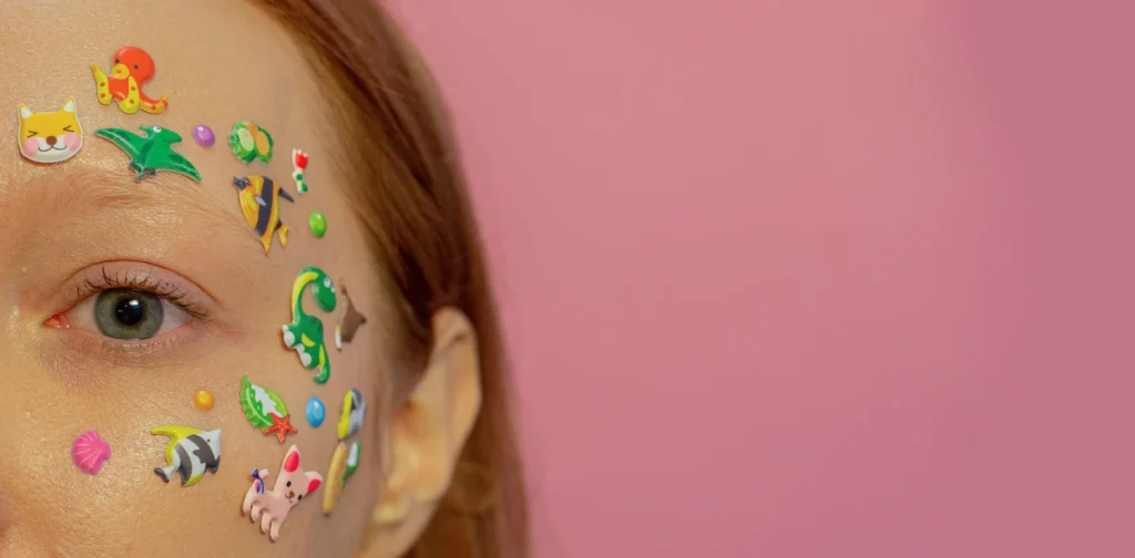 a closeup of a woman's face covered in stickers