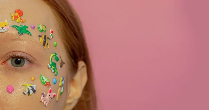 a closeup of a woman's face covered in stickers